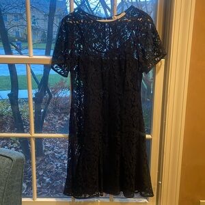 Michaell Kors lace overlay short sleeve navy dress. Button enclosure in back.